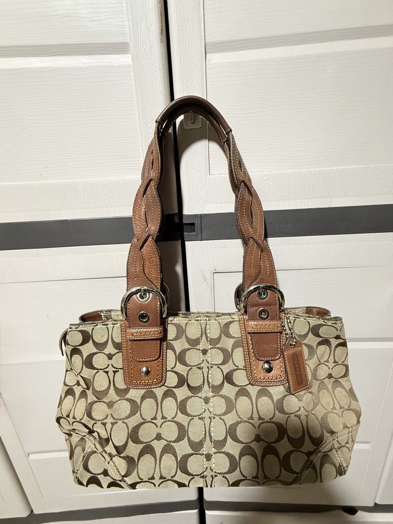 Coach Soho pleated tote Braided Straps (Category: Luxury Bags & Wallets) located in Paranaque City. Submitted by calmpenguin_066c94 (Listing ID 1467870913, Image 2). Description: - Authentic Coach Soho pleated tote bag - Premium tan leather trim with stylish braided shoulder handles and buckle hardware - Polished silver-tone metal details and secure zipper closure - Spacious interior featuring the official Coach creed patch (No. A0869-11863) - Cl