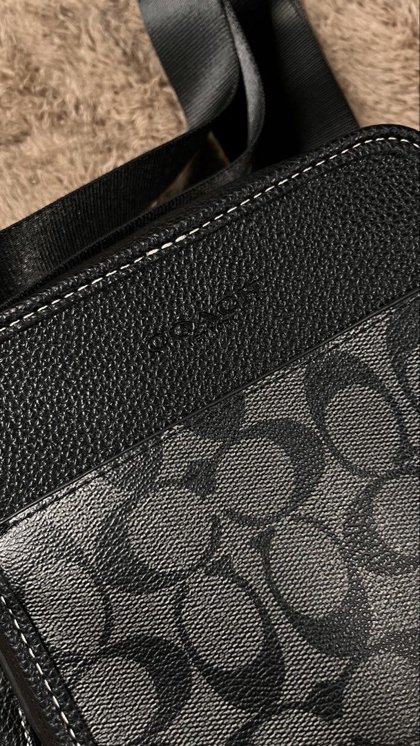 coach sullivan crossbody bag (Category: Luxury Bags & Wallets) located in Manila. Submitted by _jeanno (Listing ID 1467934129, Image 1). Description: - Brand: Coach - Material: Signature coated canvas with leather trim - Color: Black with contrast white stitching - Hardware: Gunmetal with branded zipper pulls - Strap: Adjustable webbed strap included - Condition: Clean interior and crisp exterior - Style: Compact messenger/crossbody bag, perfect 