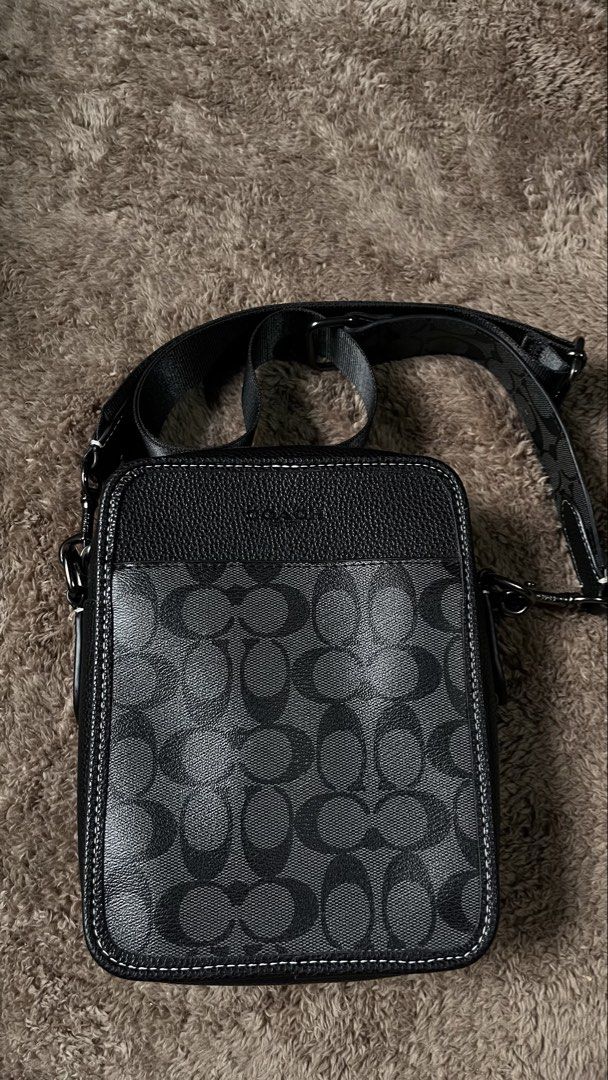 coach sullivan crossbody bag (Category: Luxury Bags & Wallets) located in Manila. Submitted by _jeanno (Listing ID 1467934129, Image 2). Description: - Brand: Coach - Material: Signature coated canvas with leather trim - Color: Black with contrast white stitching - Hardware: Gunmetal with branded zipper pulls - Strap: Adjustable webbed strap included - Condition: Clean interior and crisp exterior - Style: Compact messenger/crossbody bag, perfect 