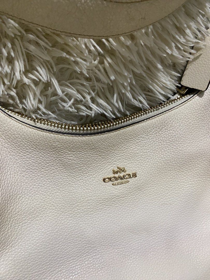 Coach Teri hobo bag (Category: Luxury Bags & Wallets) located in Manila. Submitted by switchcity (Listing ID 1467877531, Image 2). Description: - Brand: Coach - Material: Premium off-white pebble leather - Hardware: Elegant gold-tone accents - Closure: Secure top zipper with matching leather pull - Pockets: Convenient exterior zippered pocket on the back - Strap: Single comfortable shoulder strap with gold ring attachments - Interior: Clean linin