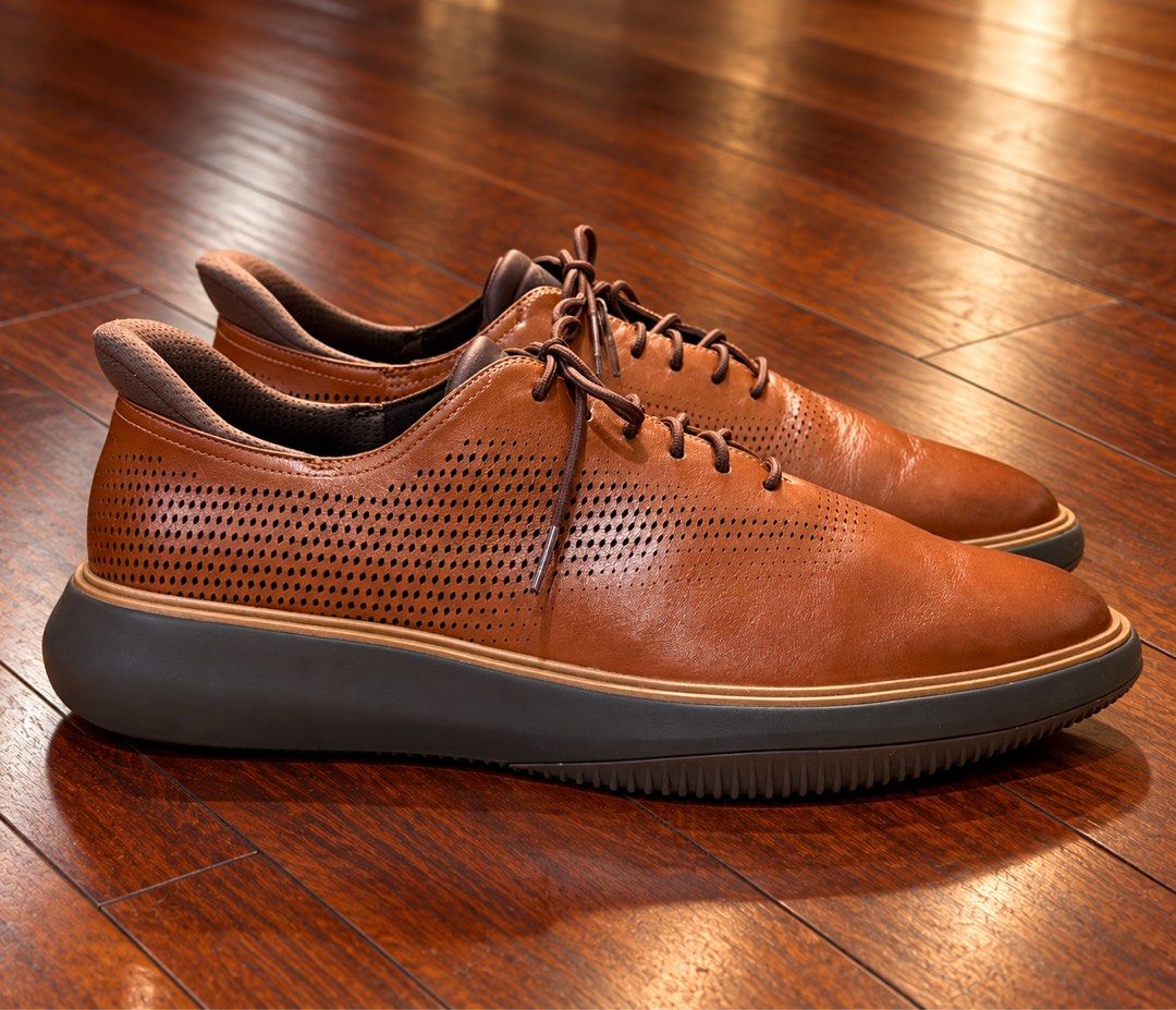 Cole Haan Grand Phase Laser Quick On Oxfords in British Tan-Java (Category: Casual Shoes) located in Paranaque City. Submitted by sole2squeeze (Listing ID 1467899527, Image 2). Description: - Brand: Cole Haan - Color: British Tan-Java - Material: Premium leather with perforated upper - Feature: Quick-on technology for hands-free slip-on functionality - Comfort: Cushioned interior collar and branded insoles - Sole: Dark chunky sole with grip patte