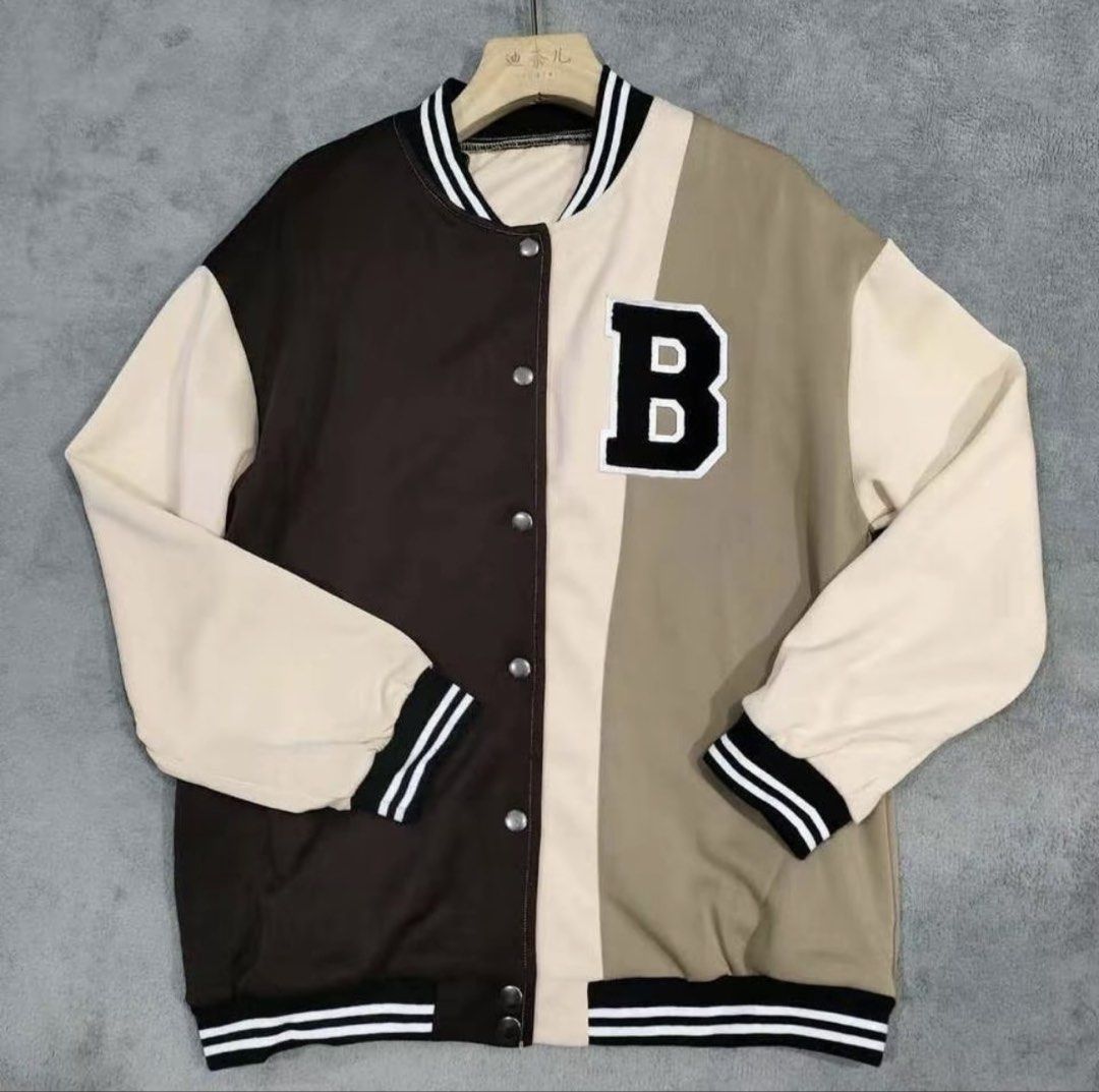 Colorblock Bomber Jacket With Letter B Patch (Category: Coats, Jackets and Outerwear) located in Baras. Submitted by vale831 (Listing ID 1468023740, Image 1). Description: - Trendy multi-color block design (dark brown, cream, and khaki) - Large embroidered 'B' patch on the chest - Classic snap button front closure - Black and white striped ribbed cuffs, collar, and hem - Soft and cozy fleece material for everyday comfort.