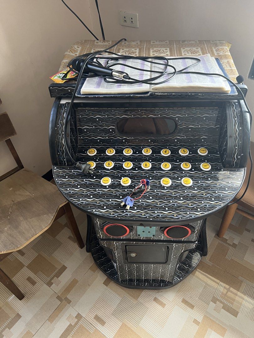 Complete Karaoke Setup with TCL 40-inch TV and Console (Category: Entertainment Systems & Smart Home Devices) located in Carmona. Submitted by tvnx746r5z (Listing ID 1467953151, Image 1). Description: - Complete working karaoke system ready for parties and gatherings - Includes TCL LED40D2700D television (mounts directly on top) - Control console cabinet with built-in speakers, numbered buttons, and coin slot - Comes complete with microphone, son