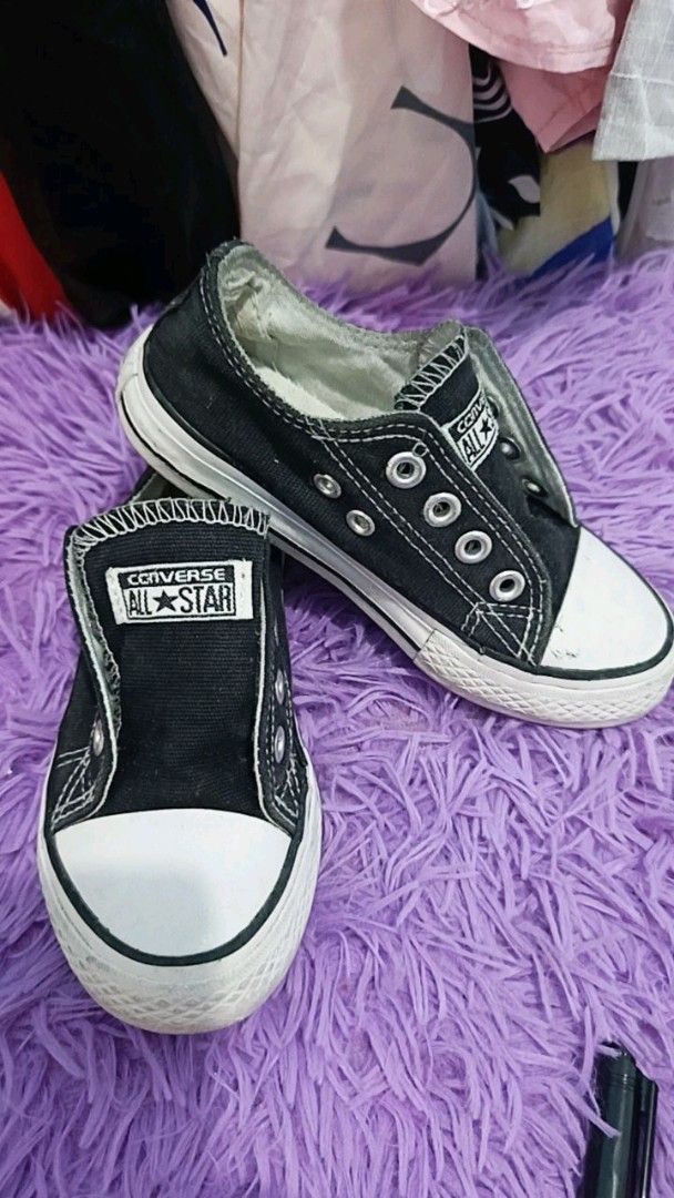 Converse All Star kids sneakers bundle black and white (Category: Babies & Kids Fashion) located in Manila. Submitted by cleverearth.ed94b6 (Listing ID 1468000577, Image 1). Description: TAKE ALL - Set of 2 pairs of classic low-top Converse All Star kids sneakers - Pair 1: converse black 13cm - Pair 2: Off-white canvas with repeating All Star text print and standard laces 15cm - Condition: Visible wear on rubber toes and soles from normal use.