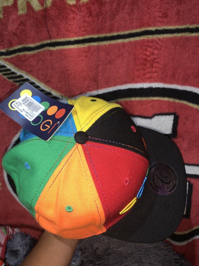 Coogi Multicolor 6-Panel Snapback Cap Hat (Category: Caps & Hats) located in Tayug. Submitted by cvcthrift (Listing ID 1468019305, Image 3). Description: - Authentic multicolor Coogi snapback hat with bright red, yellow, green, blue, and black panels - Features a large embroidered Coogi logo on the front - Flat black brim with original sticker still attached - Adjustable plastic snap closure at the back for a customized fit - Brand new with tags 