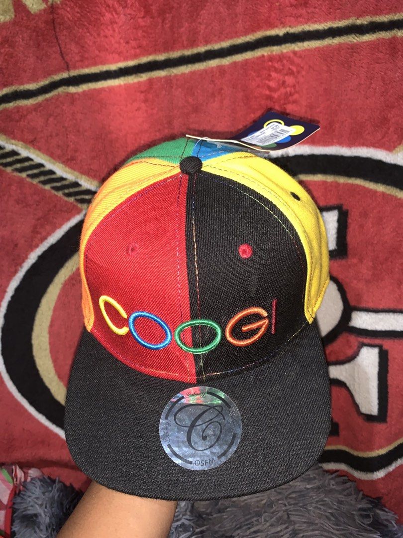 Coogi Multicolor 6-Panel Snapback Cap Hat (Category: Caps & Hats) located in Tayug. Submitted by cvcthrift (Listing ID 1468019305, Image 2). Description: - Authentic multicolor Coogi snapback hat with bright red, yellow, green, blue, and black panels - Features a large embroidered Coogi logo on the front - Flat black brim with original sticker still attached - Adjustable plastic snap closure at the back for a customized fit - Brand new with tags 