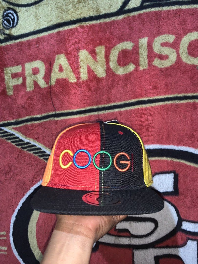 Coogi Multicolor 6-Panel Snapback Cap Hat (Category: Caps & Hats) located in Tayug. Submitted by cvcthrift (Listing ID 1468019305, Image 1). Description: - Authentic multicolor Coogi snapback hat with bright red, yellow, green, blue, and black panels - Features a large embroidered Coogi logo on the front - Flat black brim with original sticker still attached - Adjustable plastic snap closure at the back for a customized fit - Brand new with tags 