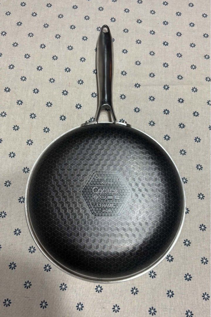 Cookcell Ceramic 22cm Non-Stick Frying Pan (Category: Cookware & Accessories) located in San Mateo. Submitted by kusinaninanan (Listing ID 1467984741, Image 2). Description: - Brand: Cookcell - Size: 22cm frying pan - Surface: Unique honeycomb textured ceramic non-stick coating (inside and out) - Handle: Stainless steel with a convenient hanging hole - Compatibility: Works on gas, electric, and induction cooktops - Origin: Designed in Korea - Con