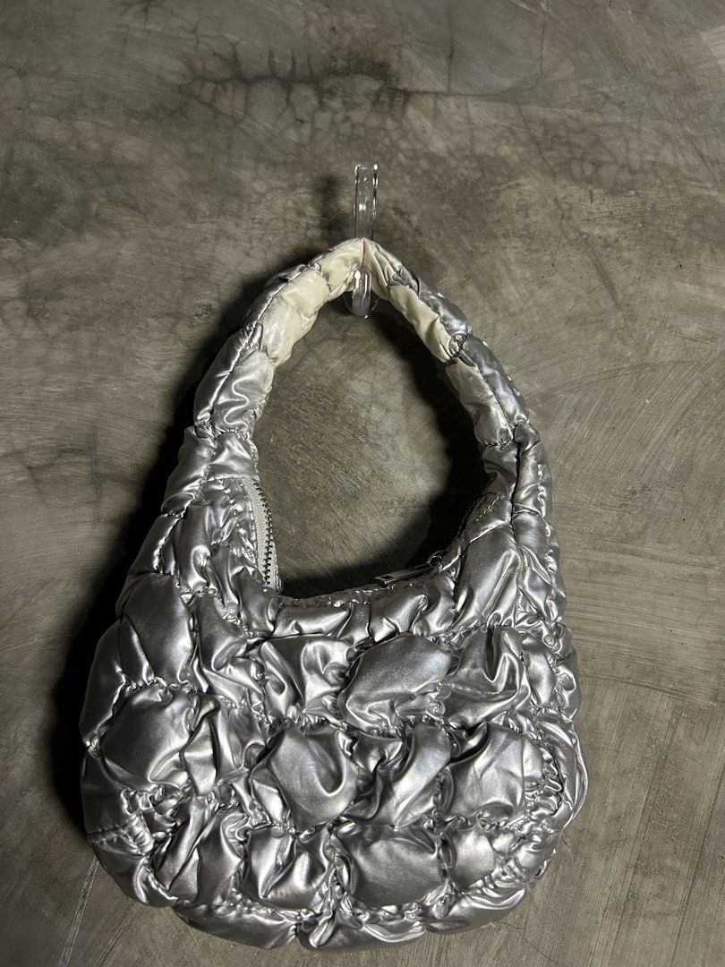 COS - Silver Quilted Micro Bag (Category: Purses & Pouches) located in Tayabas. Submitted by streetdepartment (Listing ID 1467999041, Image 2). Description: COS - Silver Quilted Micro Bag Very good condition Issue: the under part of the handle are faded Dm to purchase! Note: Manage your expectations as you are dealing with secondhand items. Color may vary due to lighting. No return / No refund! If you have other questions, feel free to message me