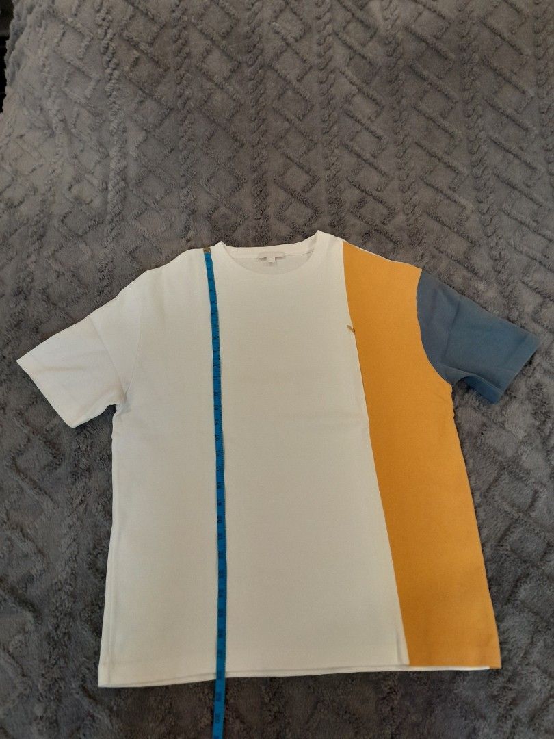 COS Colourblock T-shirt Size M (Category: Tshirts & Polo Shirts ) located in Las Pinas. Submitted by maljun1972 (Listing ID 1467923328, Image 3). Description: - Brand/Style: COS colorblock t-shirt (white, yellow, and blue) - Size: Medium - Material: Smooth cotton fabric - Design: Crew neckline with short sleeves - Measurements: ~21" chest width, ~29" length - Condition: Clean, no major flaws.