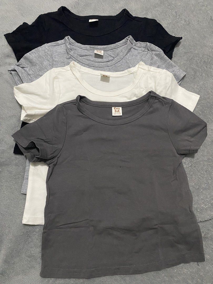 Cozy Cub Toddler T-Shirts Bundle 18-24M (Category: Babies & Kids Fashion) located in Manila. Submitted by love_mami (Listing ID 1467912003, Image 1). Description: - Brand: Cozy Cub - Size: 18-24 months - Quantity: Bundle of 4 t-shirts - Colors: Black, grey, white, and dark grey - Design: Short sleeves, round neckline, plain solid colors - Material: Soft, breathable cotton - Condition: Great for everyday wear and easy to mix and match with any bot