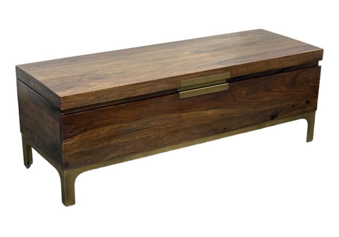 Crate & Barrel Jada Trunk (Category: Other Home Furniture) located in Caloocan City. Submitted by crateandbarrel (Listing ID 1468028629, Image 3). Description: Accents: Designed with slender, burnished bronze-toned metal legs and a matching discreet center pull on the flip-top lid. Dimensions: Approximately 129.5 cm wide, 45.7 cm deep, and 45.1 cm high. - Style: Mid-century modern aesthetic with clean lines - Material: Rich wood with natural grai