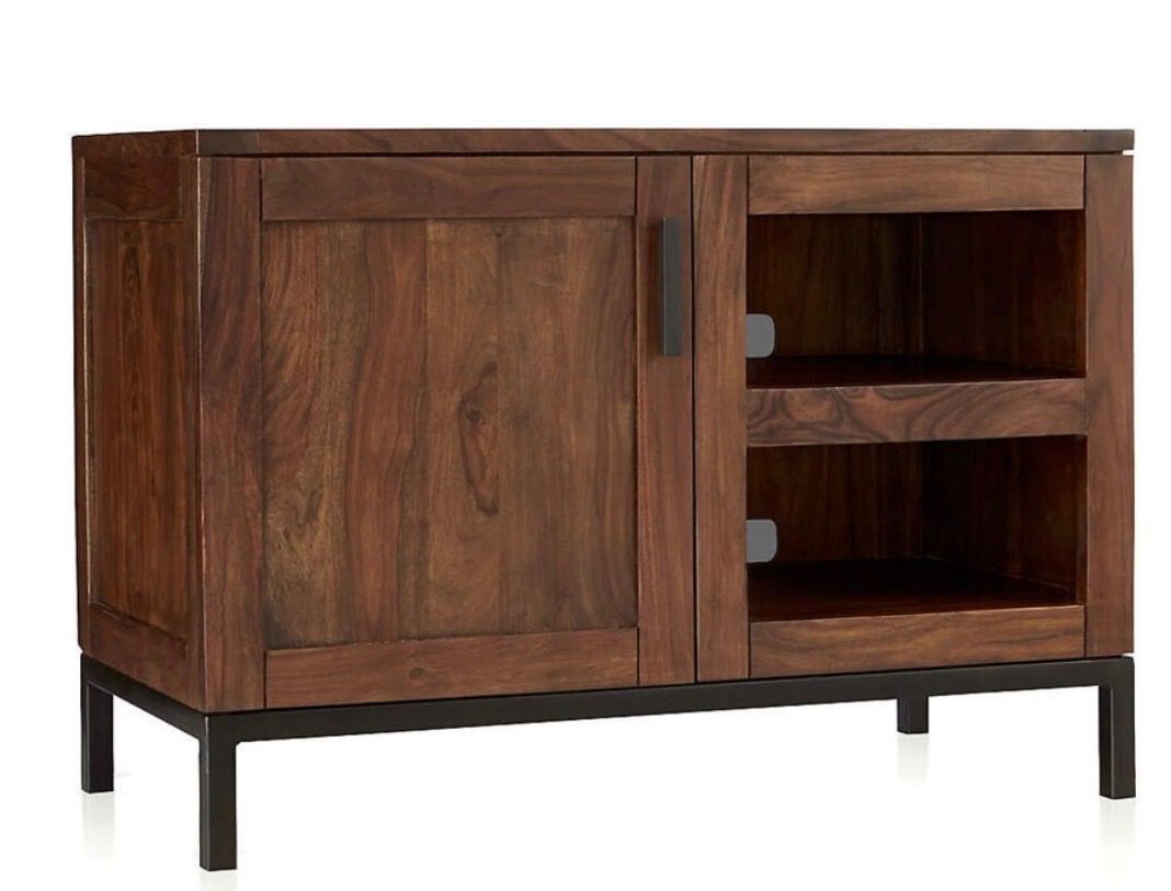 Crate & Barrel Wyatt 40" Media Console (Category: TV Consoles) located in Caloocan City. Submitted by crateandbarrel (Listing ID 1468029870, Image 1). Description: Overall Dimensions Width: 101.6cm Height: 71.12cm Depth: 50.8cm Height: 12.7cm This piece is crafted from solid wood and is recognizable by its flush inset cabinet doors, minimalist open storage shelves, and slim black iron frame base legs. - Rich brown wood grain finish with sturdy bl