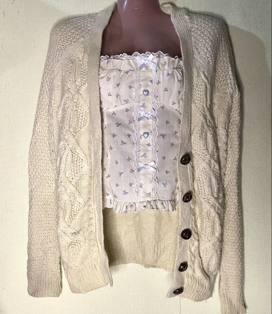 Cream cable knit cardigan (Category: Coats, Jackets and Outerwear) located in Las Pinas. Submitted by jewicka (Listing ID 1467988809, Image 1). Description: - Cream chunky knit cardigan with thick cable patterns and big brown buttons - Ideal and cozy for cooler weather days.