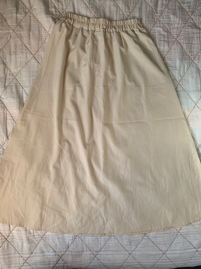 Cream Midi Skirt with Side Slit (Category: Skirts) located in Bacoor. Submitted by krisery (Listing ID 1467953815, Image 2). Description: - Color: Cream/Light Beige - Style: Midi length withSide Slit - Waist: 24-29 inch (stretchable) - Length: 33 inch - Bottom Wide: 36 inch (flat-lay) - With Elastic Waist Band - Material: Soft, flowy fabric - Condition: 10/10 - No Damage.
