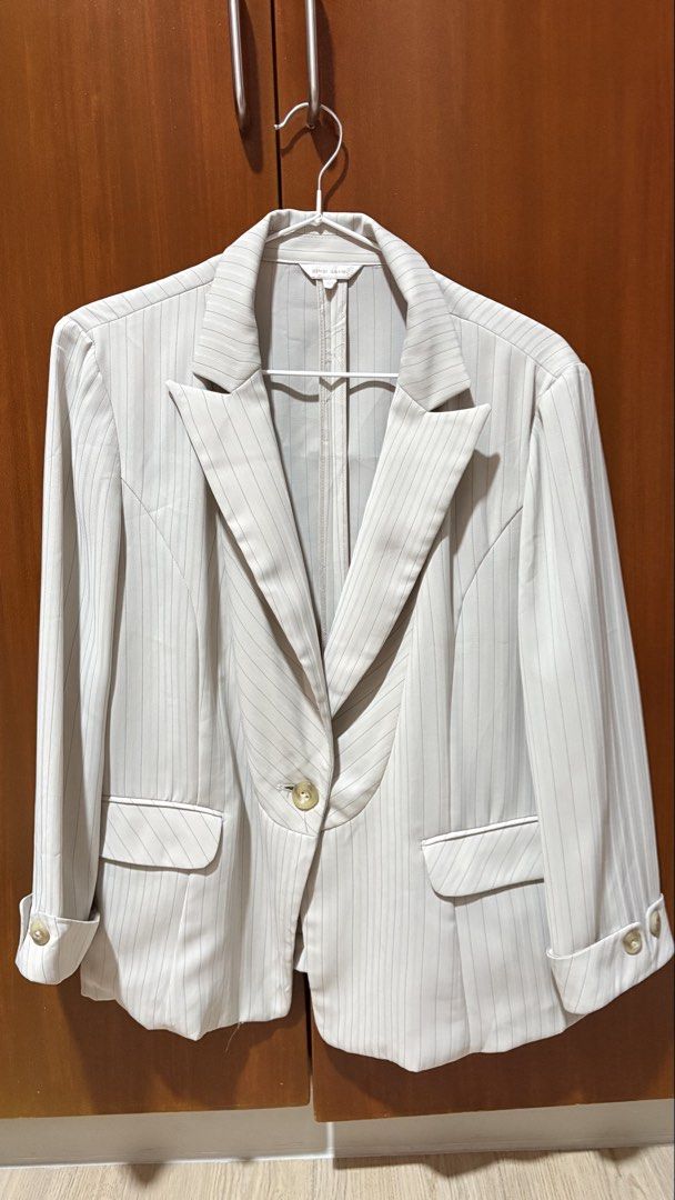 Cream Pinstripe Blazer Jacket with Lapels (Category: Coats, Jackets and Outerwear) located in Taytay. Submitted by sparklesandhighheels (Listing ID 1467884786, Image 1). Description: - Color/Pattern: Cream with thin vertical pinstripes - Closure: Single front button - Collar: Classic lapel design - Pockets: Two functional front flap pockets - Sleeves: Long with stylish folded cuffs and button details - Lining: Fully lined for comfort - Condition: