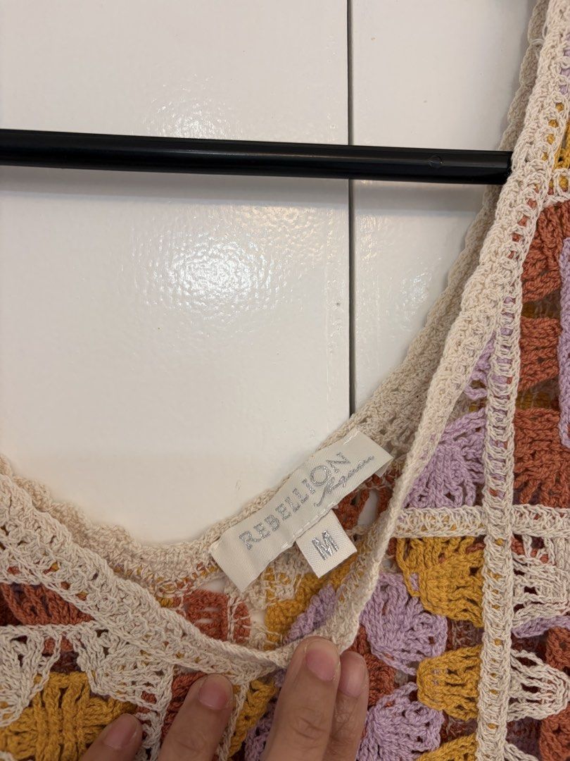 Crochet Granny Square Tank Top (Category: Sleeveless) located in Quezon City. Submitted by prelovedbynxkole (Listing ID 1467884874, Image 2). Description: - Brand: REBELLION - Style: Crochet tank top with colorful granny square pattern - Colors: Cream base with mustard yellow, dusty rose, and lavender patches - Details: V-neckline, sleeveless - Size: M - Condition: Worn once - Perfect for: Casual days out, looks super cute with high-waisted jeans