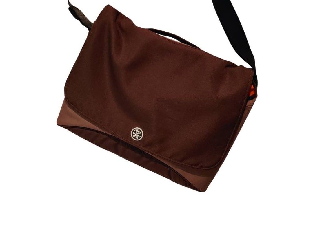 Crumpler Messenger Bag Brown Shoulder Bag (Category: Sling Bags) located in Cebu City. Submitted by krisiiiiesale (Listing ID 1468001253, Image 2). Description: - Brand: Crumpler - Color: Deep Brown - Condition: Excellent, minimal wear on hardware and fabric, clean inside and out - Features: Adjustable black strap, convenient top handle grip, iconic Crumpler logo snap button closure - Capacity: Roomy interior ideal for daily commute, school, or c