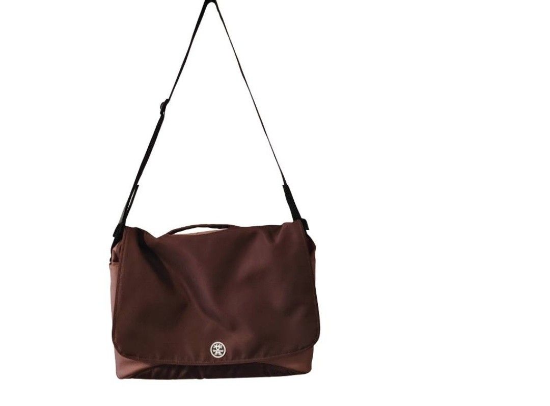 Crumpler Messenger Bag Brown Shoulder Bag (Category: Sling Bags) located in Cebu City. Submitted by krisiiiiesale (Listing ID 1468001253, Image 1). Description: - Brand: Crumpler - Color: Deep Brown - Condition: Excellent, minimal wear on hardware and fabric, clean inside and out - Features: Adjustable black strap, convenient top handle grip, iconic Crumpler logo snap button closure - Capacity: Roomy interior ideal for daily commute, school, or c