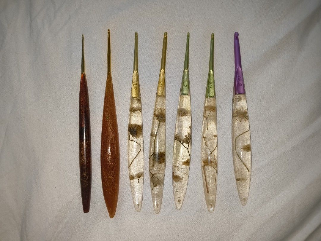 Custom Resin and Metal Crochet Hook Set (Category: Handmade Craft) located in Antipolo. Submitted by kei.regalado (Listing ID 1467918509, Image 2). Description: - Set of 9 crochet hooks featuring a mix of handmade resin handles with real pressed flowers and metallic styles - Japan size 2/0, 3/0, 4/0, 5/0, 6/0, 7/0, 8/0, Inox size 4, Susan Bates US size 10 (6.0mm) - Includes trusted brands like Tulip and Inox, plus custom pieces - Various hook siz