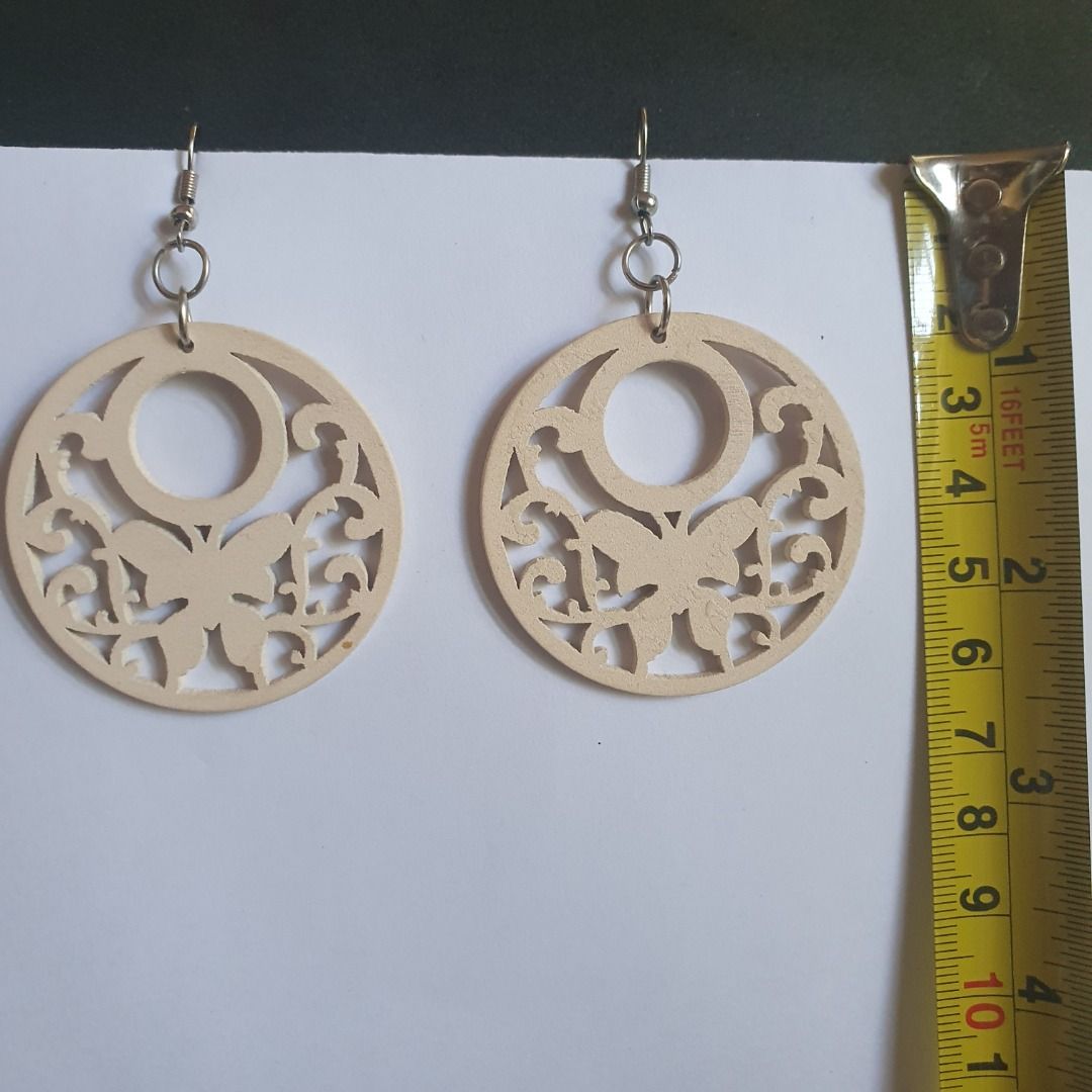 Dangling wooden statement earrings (Category: Earrings) located in Caloocan City. Submitted by mma_222 (Listing ID 1467904502, Image 2). Description: - Set of 5 assorted wooden drop earrings - Includes colorful mandalas, butterfly cutouts, medallions, and patterned dangles - Lightweight wood material with secure metal hooks - Versatile bohemian style for everyday use or special occasions - Great variety pack offering different shapes and patterns