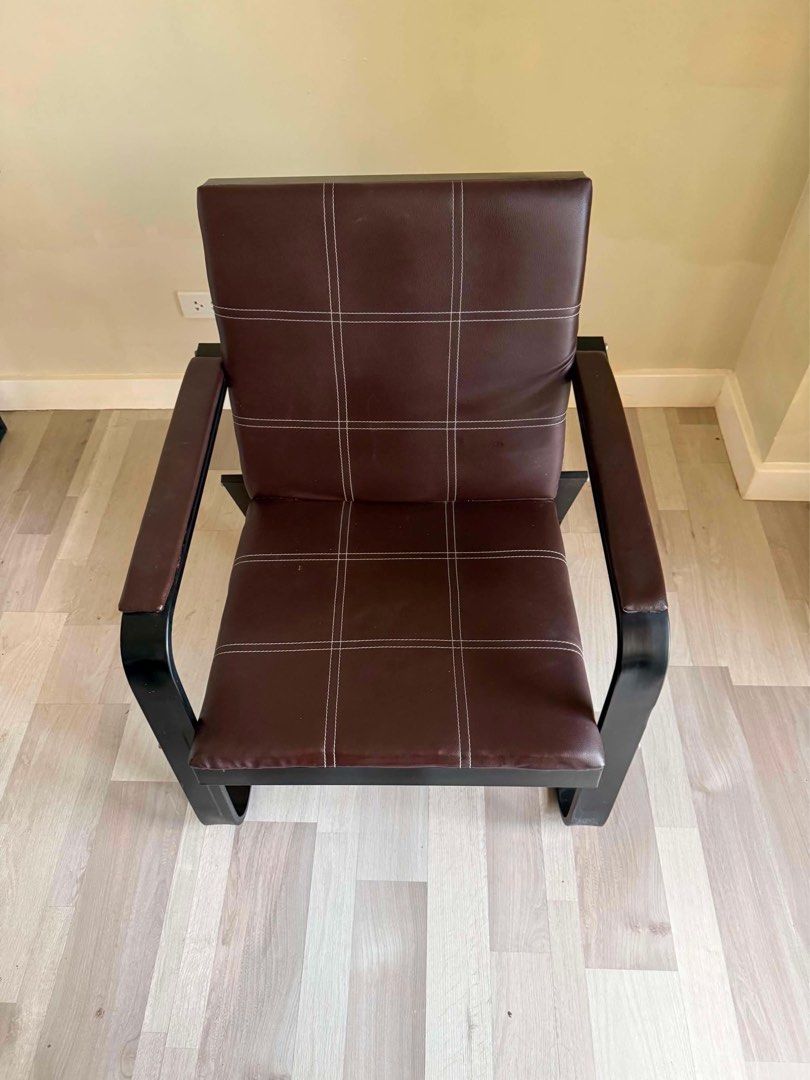 Dark Brown Armchair with Black Metal Frame (Category: Chairs) located in Cebu City. Submitted by kirahangeline (Listing ID 1467879178, Image 2). Description: - Modern armchair featuring dark brown upholstery with chic white stitching - Sleek black curved metal frame that seamlessly forms the legs and armrests - Thickly padded seat and backrest with a stylish grid-pattern design.
