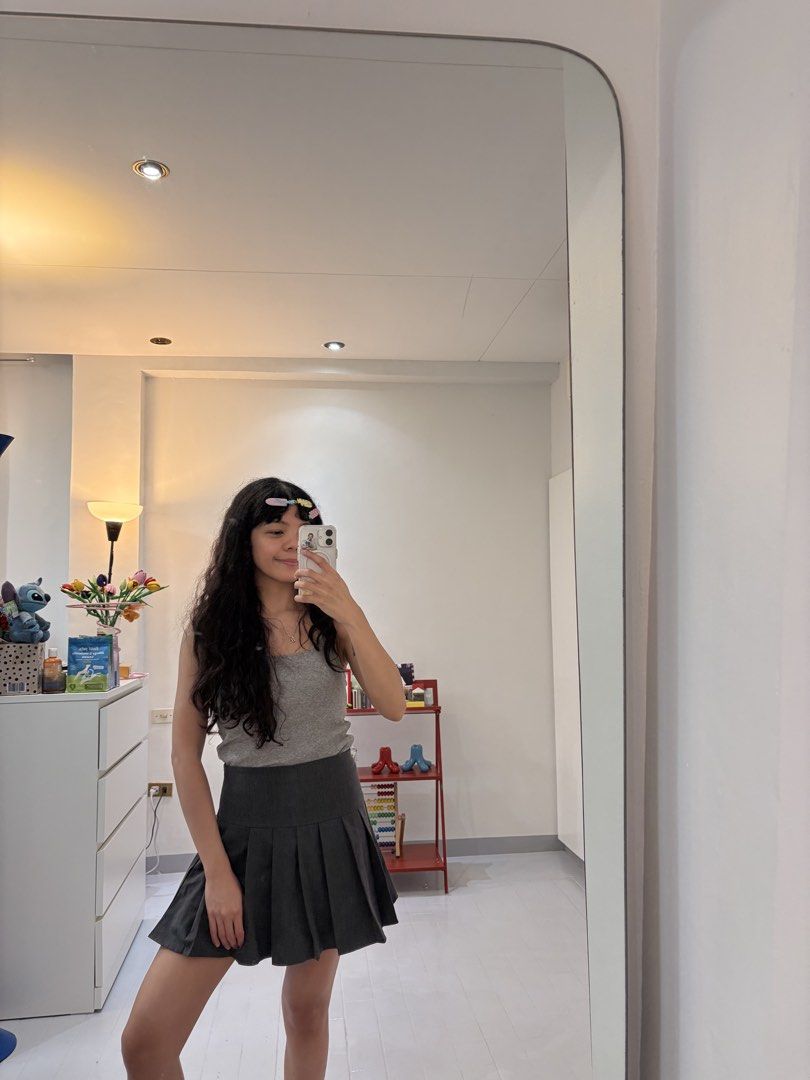 Dark Grey Pleated Mini Skort (Category: Skirts) located in Quezon City. Submitted by prelovedbynxkole (Listing ID 1467880459, Image 2). Description: - Color: Dark grey - Fit: High-waist with structured pleats - Feature: Built-in shorts underneath (skirt look, shorts comfort) - Condition: Worn once for a mirror selfie, practically new - Styling: Pairs easily with basic tanks or tees ALL CLOTHES NEED TO BE WASHED & IRONED AS THEY HAVE BEEN SITTING 