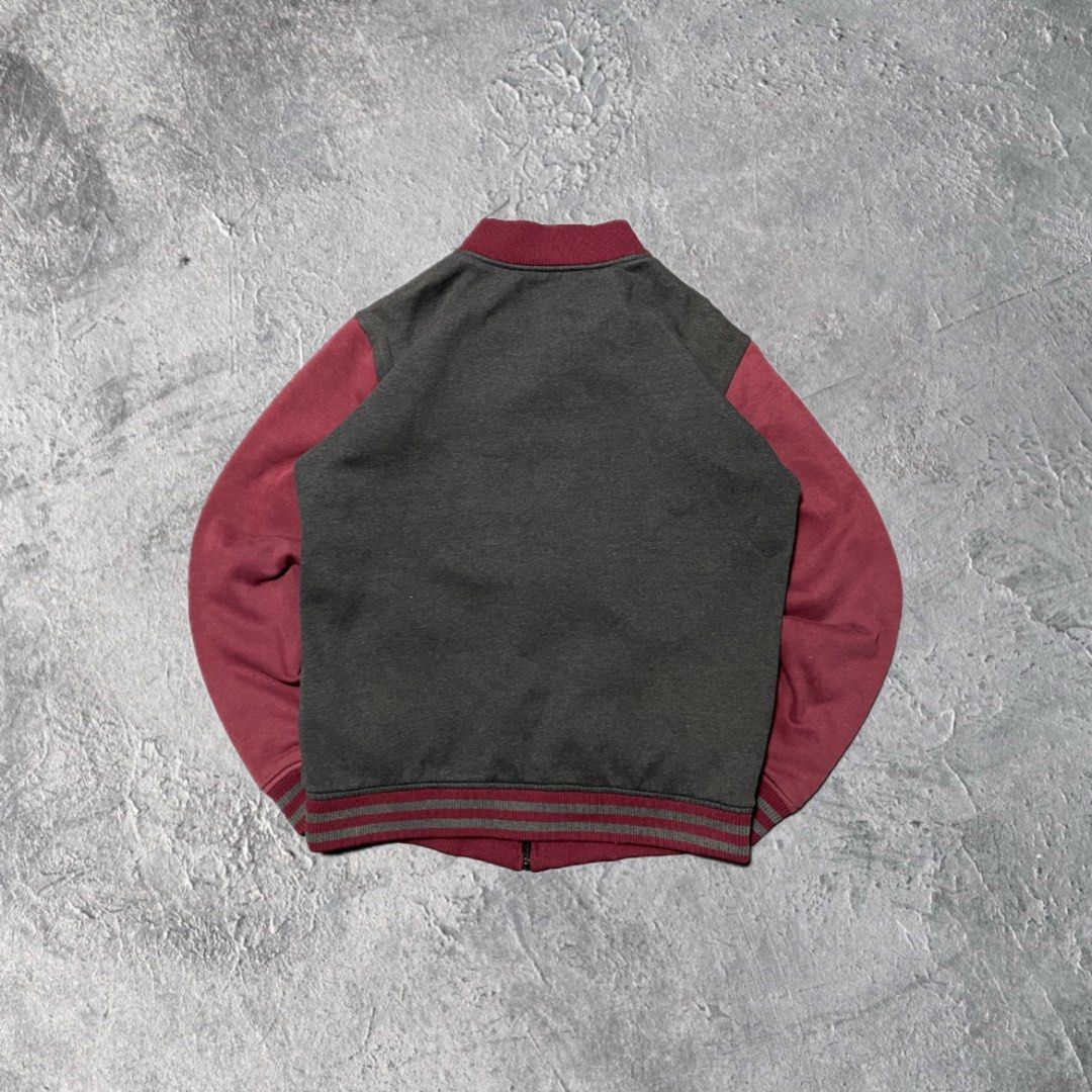 DC Shoe Co Skateboarding Varsity Bomber Jacket Grey Maroon (Category: Coats, Jackets and Outerwear) located in Pasig City. Submitted by thrift2mnl (Listing ID 1467976803, Image 2). Description: - DC Shoes Varsity Bomber Jacket - M on tag ; 22 x 25 - Brand: DC Shoe Co - Style: Varsity bomber jacket / Skate style - Colors: Dark grey body with maroon sleeves and ribbed trim - Details: Full zip closure, front slip pockets, quilted inner lining - Grap