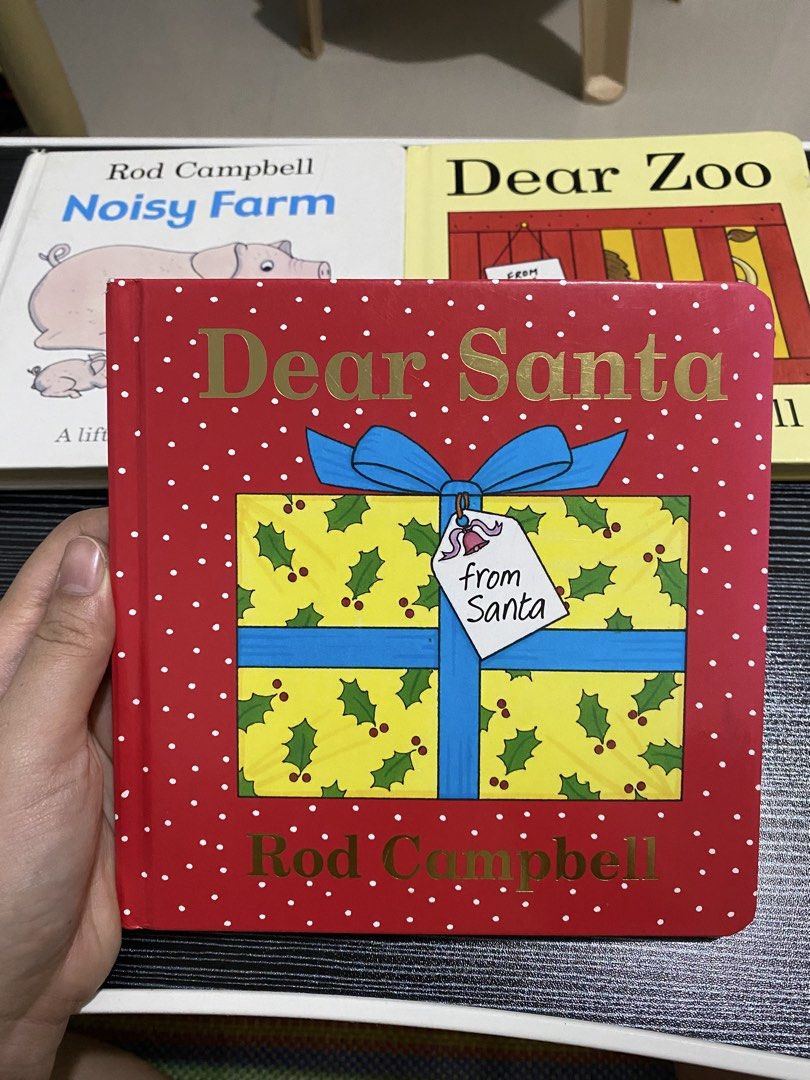 Dear Santa by Rod Campbell board book (Category: Children's Books) located in Manila. Submitted by love_mami (Listing ID 1467914560, Image 1). Description: - Title: Dear Santa by Rod Campbell - Format: Classic lift-the-flap Christmas book for toddlers - Design: Bright red cover with gold lettering and a yellow present illustration - Condition/Setting: Great holiday read for young kids (other Rod Campbell books like Noisy Farm and Dear Zoo also av