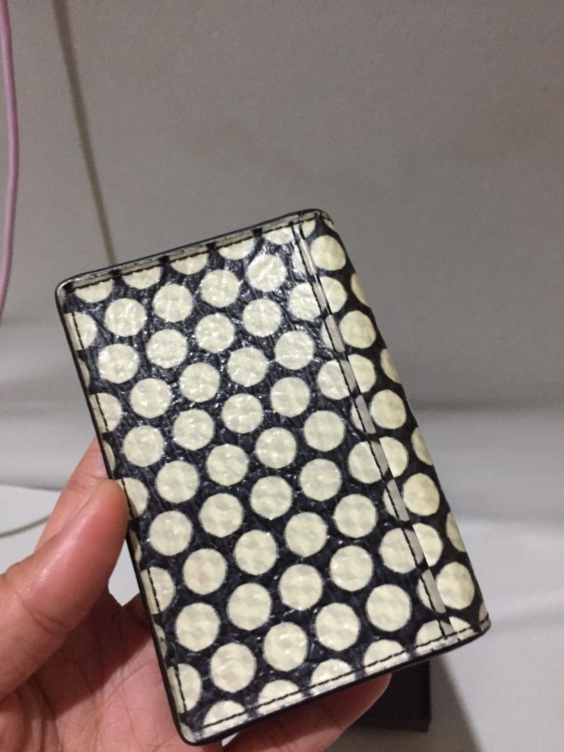 DECKE CARD WALLET LEATHER (Category: Wallets & Card holders) located in Bulacan. Submitted by assorted.items (Listing ID 1467990599, Image 2). Description: DECKEN black and white polka-dot leather card case or small wallet featuring a central metallic clasp..