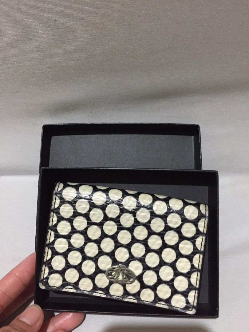 DECKE CARD WALLET LEATHER (Category: Wallets & Card holders) located in Bulacan. Submitted by assorted.items (Listing ID 1467990599, Image 1). Description: DECKEN black and white polka-dot leather card case or small wallet featuring a central metallic clasp..