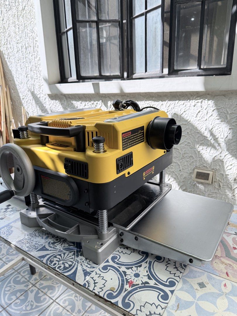 DeWalt 735 Thickness Planer with Free Dewalt Folding Table (Category: Construction Tools & Equipment) located in Quezon City. Submitted by bentangpalugi (Listing ID 1467907216, Image 2). Description: - Brand: DeWalt - Type: Heavy-Duty Thickness Planer - Color: Classic Yellow & Black - Condition: Excellent working condition, only used once, perfect for woodworking - Features: Heavy metal base, smooth feed table surface, and rear dust port Original