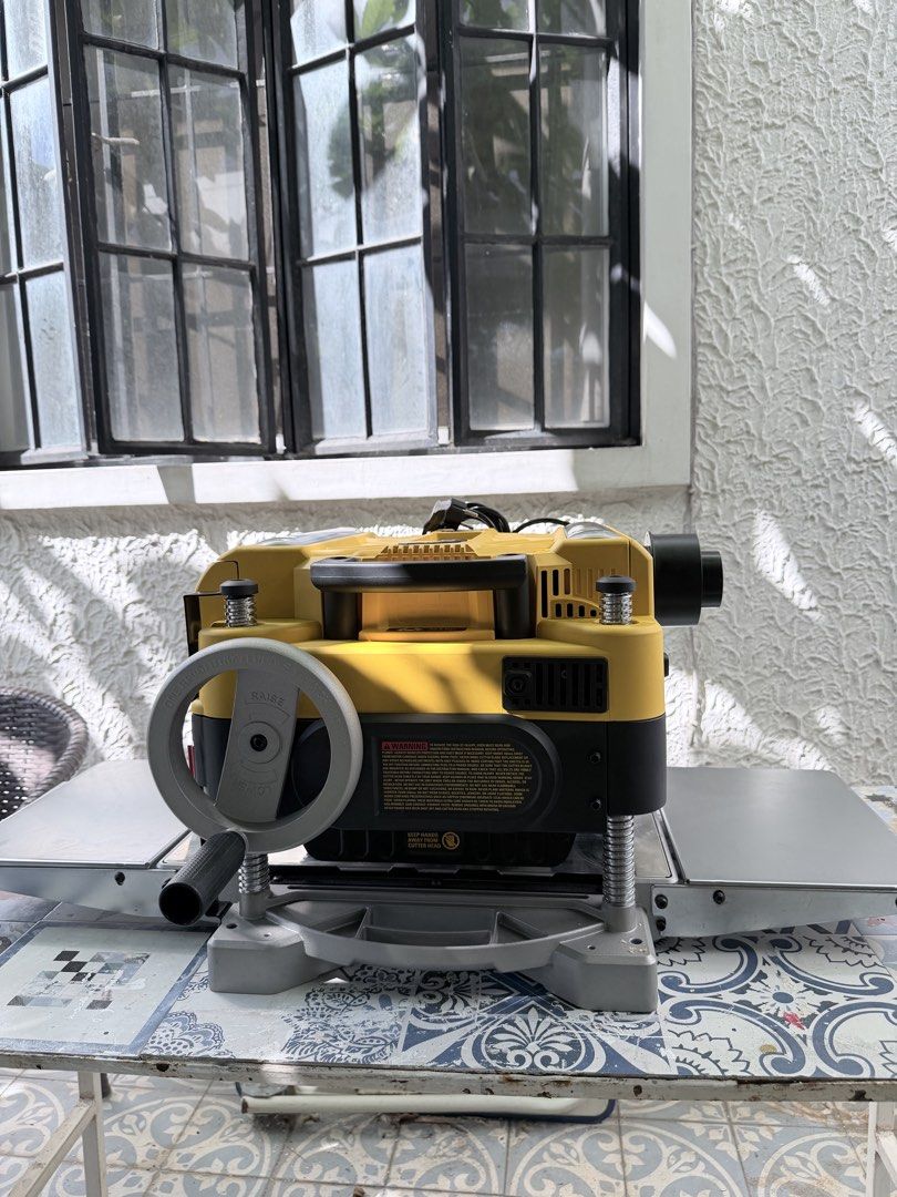 DeWalt 735 Thickness Planer with Free Dewalt Folding Table (Category: Construction Tools & Equipment) located in Quezon City. Submitted by bentangpalugi (Listing ID 1467907216, Image 3). Description: - Brand: DeWalt - Type: Heavy-Duty Thickness Planer - Color: Classic Yellow & Black - Condition: Excellent working condition, only used once, perfect for woodworking - Features: Heavy metal base, smooth feed table surface, and rear dust port Original