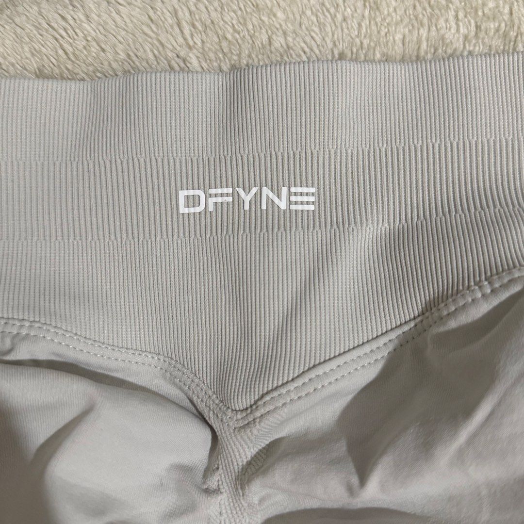 DFYNE Grey Ribbed Workout Shorts (Category: Activewear) located in Caloocan City. Submitted by bellita_05 (Listing ID 1468001254, Image 2). Description: DFYNE workout shorts in light grey. High ribbed waistband with brand logo on the front and inner text. Sculpting seam details on the back. Stretchy fabric, super comfortable for gym sessions or running errands. Great addition to activewear wardrobe..