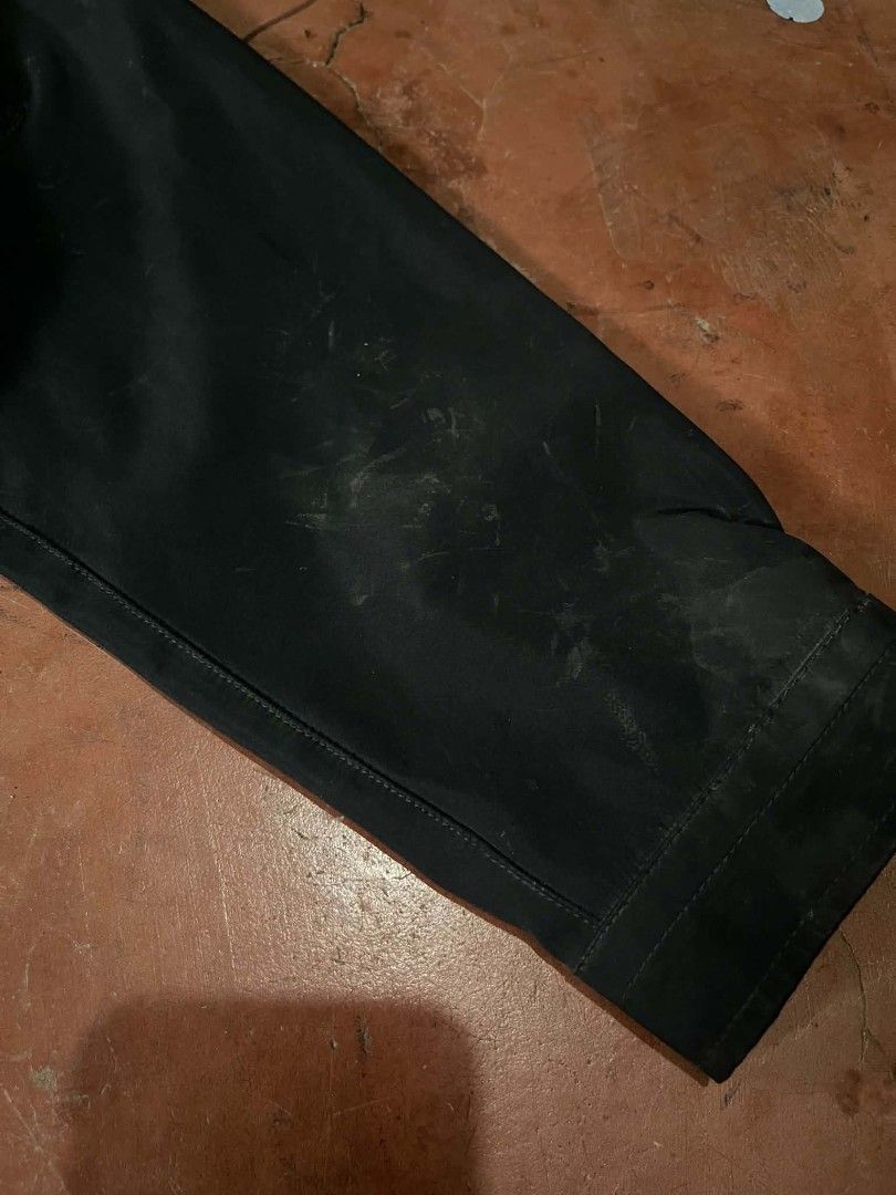 Dickies Black Coaches Jacket Size M (Category: Coats, Jackets and Outerwear) located in Gumaca. Submitted by makuliti (Listing ID 1467955220, Image 3). Description: - Brand: Dickies - Item: Coach Jacket - Color: Black with yellow graphic logo on chest - Size: Medium - Features: Snap-button front, collar, drawstring hem, and side welt pockets - Condition: Shows noticeable scuffs and marks on sleeves and front body as pictured.