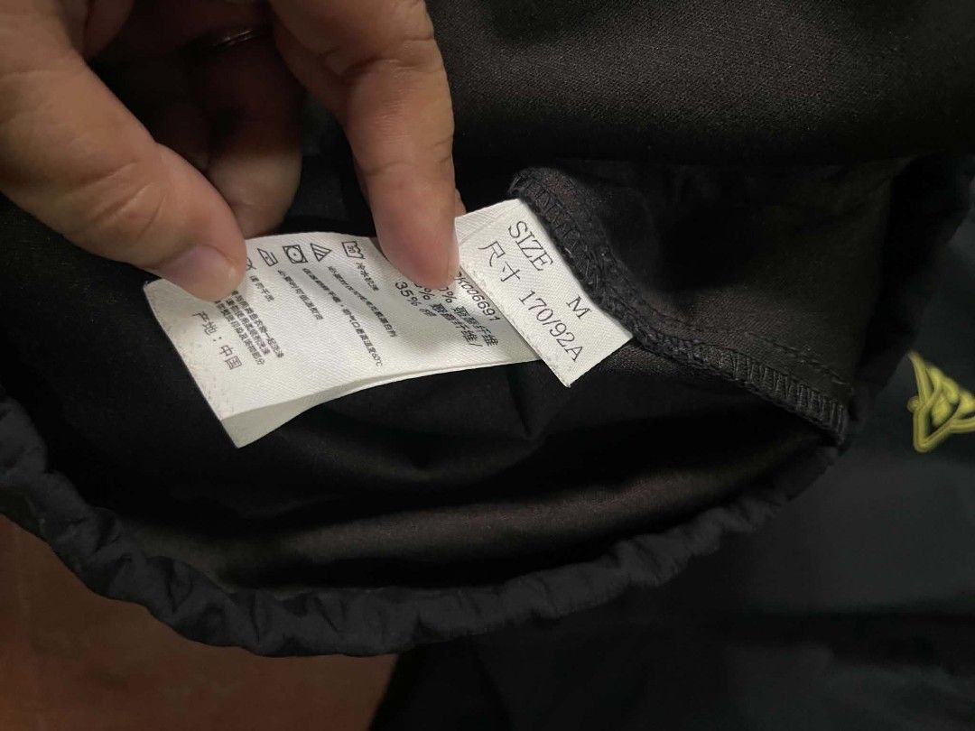 Dickies Black Coaches Jacket Size M (Category: Coats, Jackets and Outerwear) located in Gumaca. Submitted by makuliti (Listing ID 1467955220, Image 2). Description: - Brand: Dickies - Item: Coach Jacket - Color: Black with yellow graphic logo on chest - Size: Medium - Features: Snap-button front, collar, drawstring hem, and side welt pockets - Condition: Shows noticeable scuffs and marks on sleeves and front body as pictured.