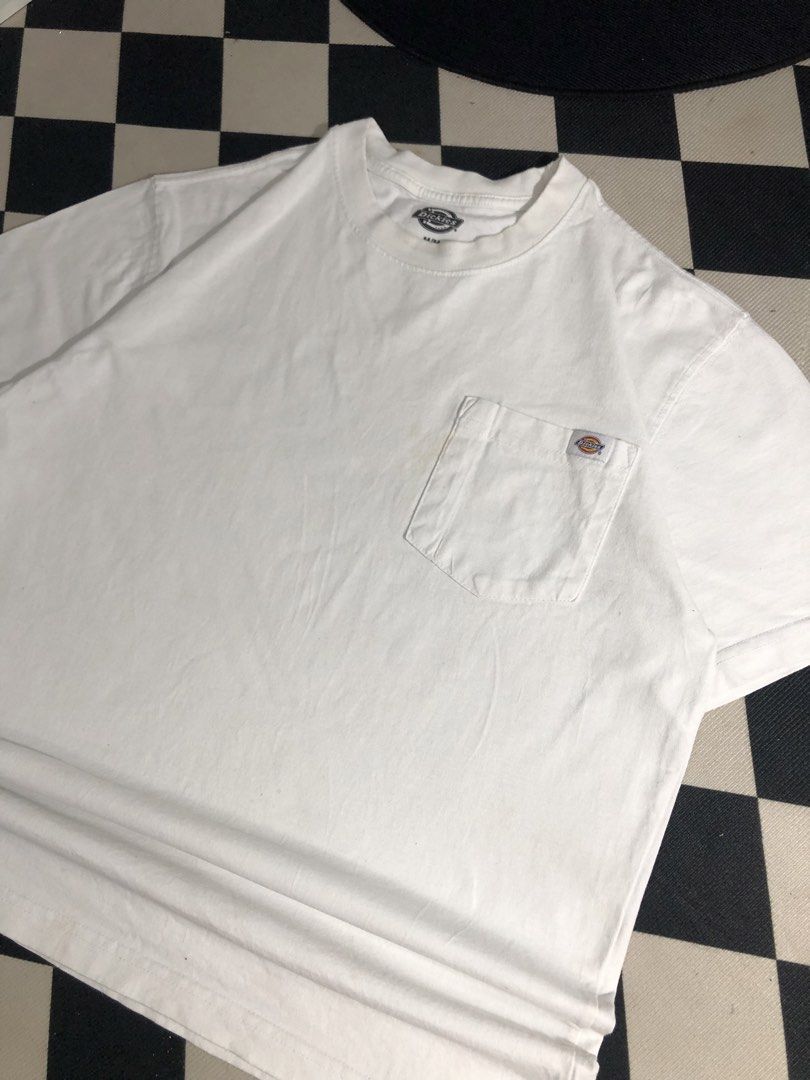 Dickies Shirt White Size Medium. Dimes: 22X28 (Category: Tshirts & Polo Shirts ) located in Manila. Submitted by ejaay_2012 (Listing ID 1467868810, Image 3). Description: - Brand: Dickies - Color: White - Size: Medium (M) - Material: 100% Cotton, Made in Mexico - Style: Classic crew neck with chest pocket and iconic woven logo label - Condition: Good streetwear condition, with minor faint discoloration near the pocket area.