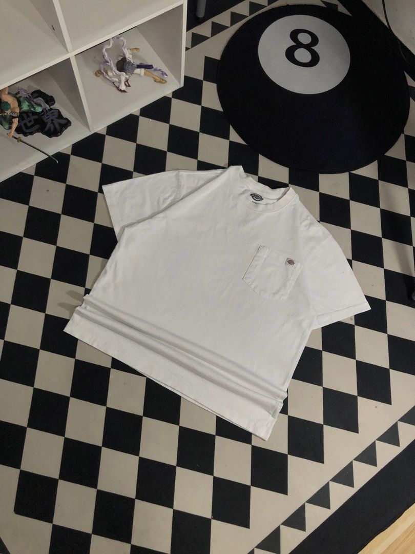 Dickies Shirt White Size Medium. Dimes: 22X28 (Category: Tshirts & Polo Shirts ) located in Manila. Submitted by ejaay_2012 (Listing ID 1467868810, Image 2). Description: - Brand: Dickies - Color: White - Size: Medium (M) - Material: 100% Cotton, Made in Mexico - Style: Classic crew neck with chest pocket and iconic woven logo label - Condition: Good streetwear condition, with minor faint discoloration near the pocket area.
