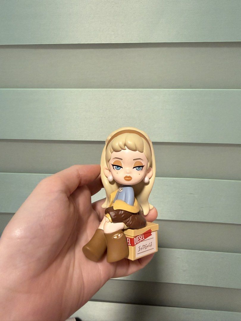 Diesel Collectible Figure (Category: Designer & Blind Box Toys) located in Balanga. Submitted by liiiizzzzzzzzz (Listing ID 1468020723, Image 2). Description: - with card - Includes a cute, miniature matching blue handbag accessory .