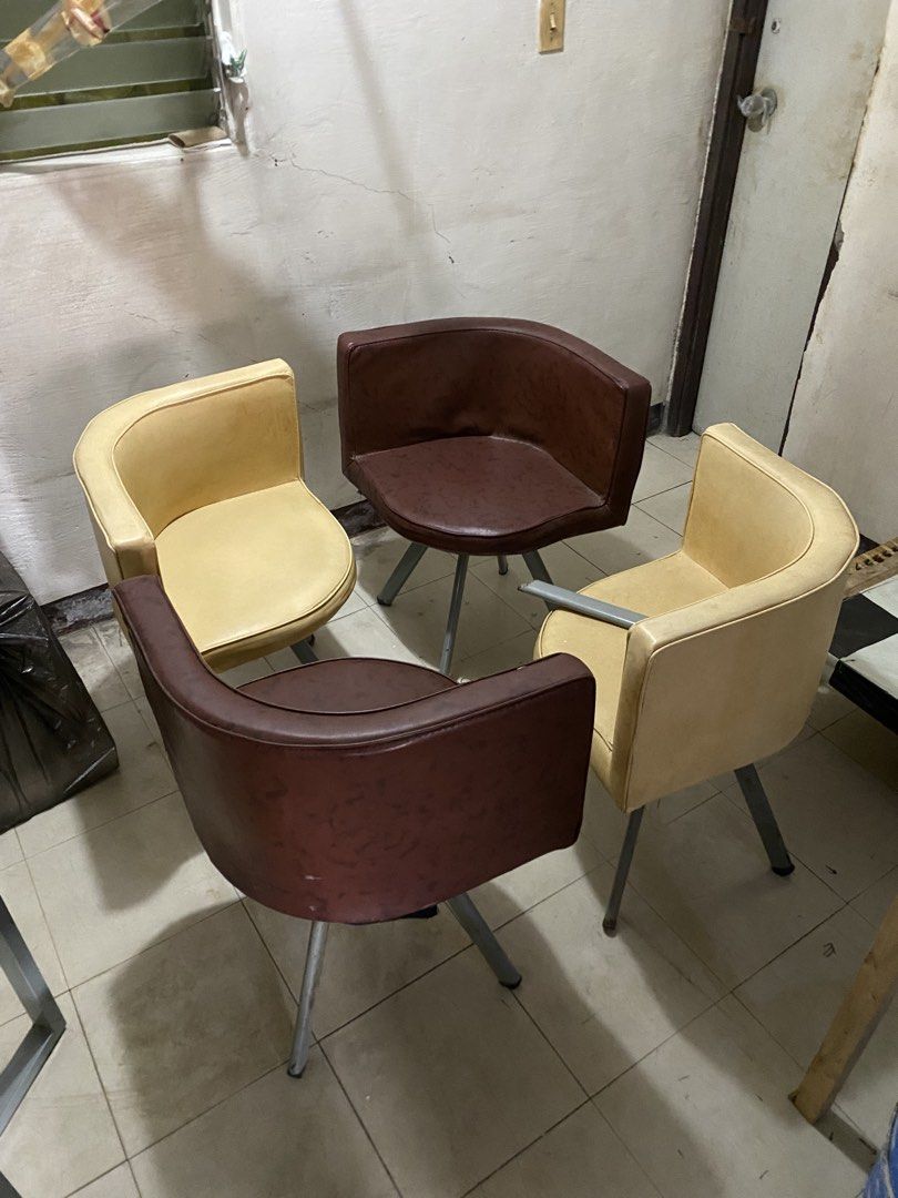 Dining table set with 4 swivel chairs (Category: Tables & Sets) located in Imus. Submitted by nhelsg2 (Listing ID 1467870605, Image 2). Description: - Dining set includes 1 square glass table and 4 matching armchairs - Table features a unique design with two green and two dark brown panels with floral prints - 4 armchairs: 2 in beige and 2 in dark brown - Chairs come with metal legs and a smooth 360-degree swivel function - ideal for compact kitc