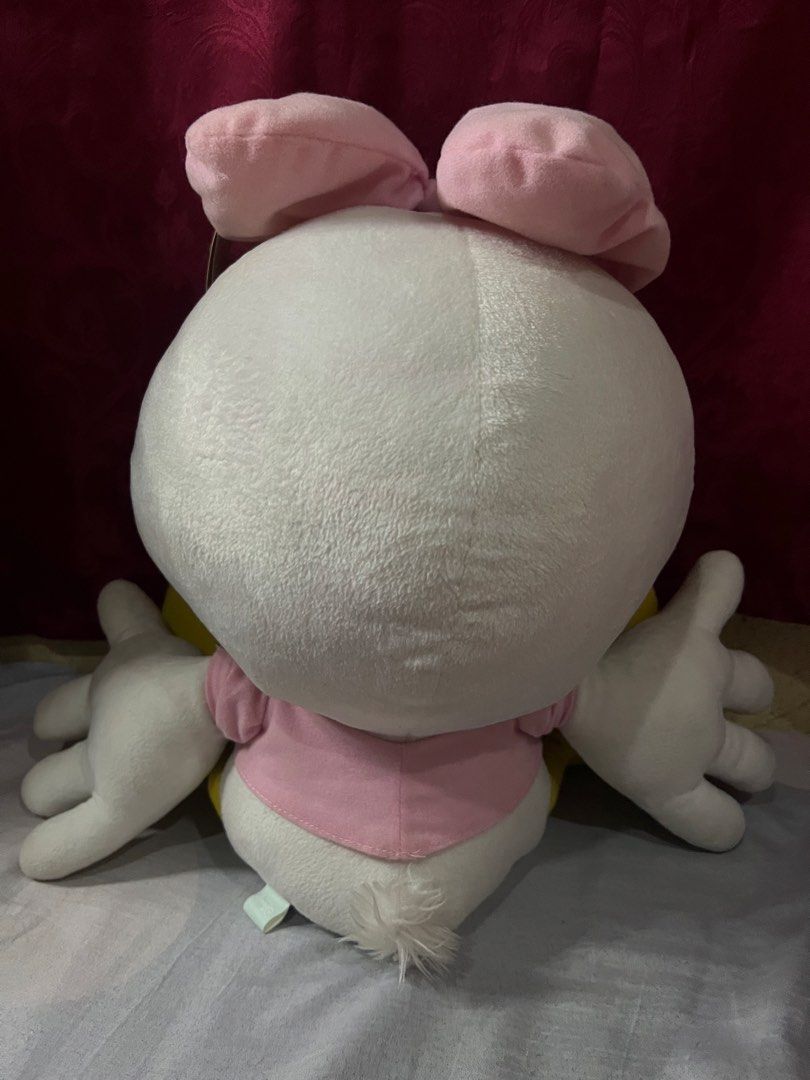 Disney Daisy Duck Plush Toy Doll (Category: Plushies & Soft Toys) located in Bulacan. Submitted by haven_plushie_dolls.888 (Listing ID 1467958508, Image 2). Description: - Crafted from ultra-soft fabric, perfect for cuddling or display - Adorable design featuring a pink bow, pink shirt, and playful winking eye - Features official 'Daisy' embroidery on the yellow foot - Great gift idea for kids, fans, and Disney merchandise collectors -Need wash.
