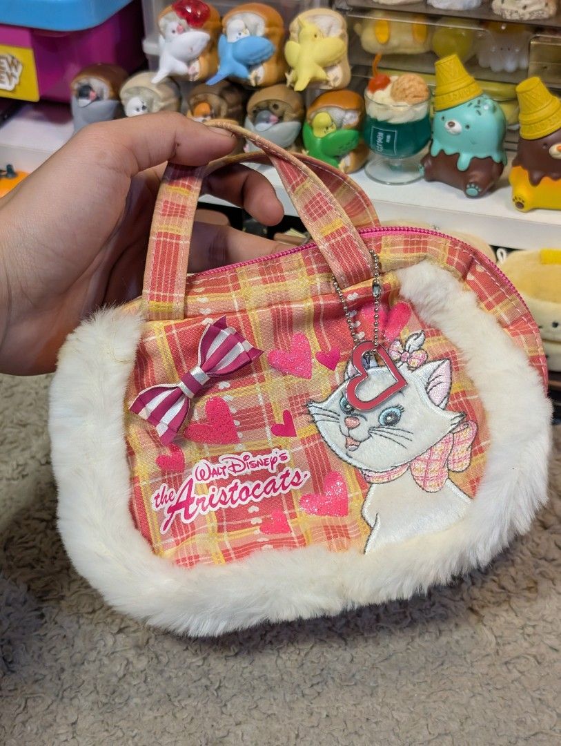 Disney Marie Cat Pouch Handbag (Category: Purses & Pouches) located in San Pedro. Submitted by eurisilvers (Listing ID 1467980599, Image 1). Description: — shipping is via J&T Express — mop: gcash, maya, bank transfer — location: san pedro city, laguna.