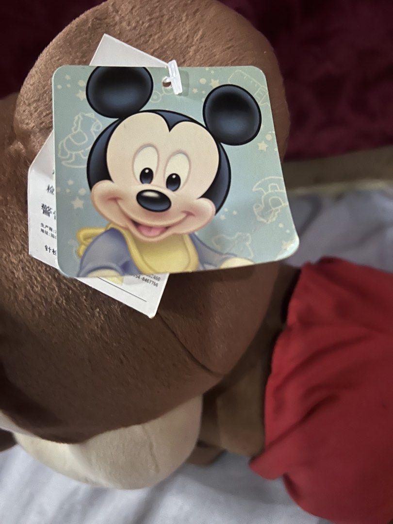 Disney Mickey Mouse lying plush toy with tags (Category: Plushies & Soft Toys) located in Bulacan. Submitted by haven_plushie_dolls.888 (Listing ID 1467959381, Image 3). Description: - Authentic Disney Mickey Mouse lying down plush toy - Super soft brown and tan fabric with iconic red shorts and yellow shoes - Original paper swing tag still attached to the ear - Official Disney tag sewn into the clothing - Perfect for collectors or as a cute gift