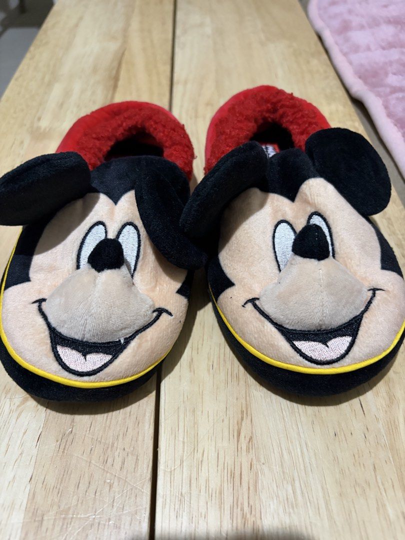 Disney Mickey Mouse Plush Slippers Red Black (Category: Slippers and slides) located in Paranaque City. Submitted by greatfinds108 (Listing ID 1467874635, Image 2). Description: - Adorable 3D Mickey Mouse face and ears on the front - Soft red fuzzy inner lining for ultimate warmth and comfort - Black outer material with stylish yellow piping along the sole - Embroidered Mickey signature detail on each heel back - Cute Disney Mickey pattern print 