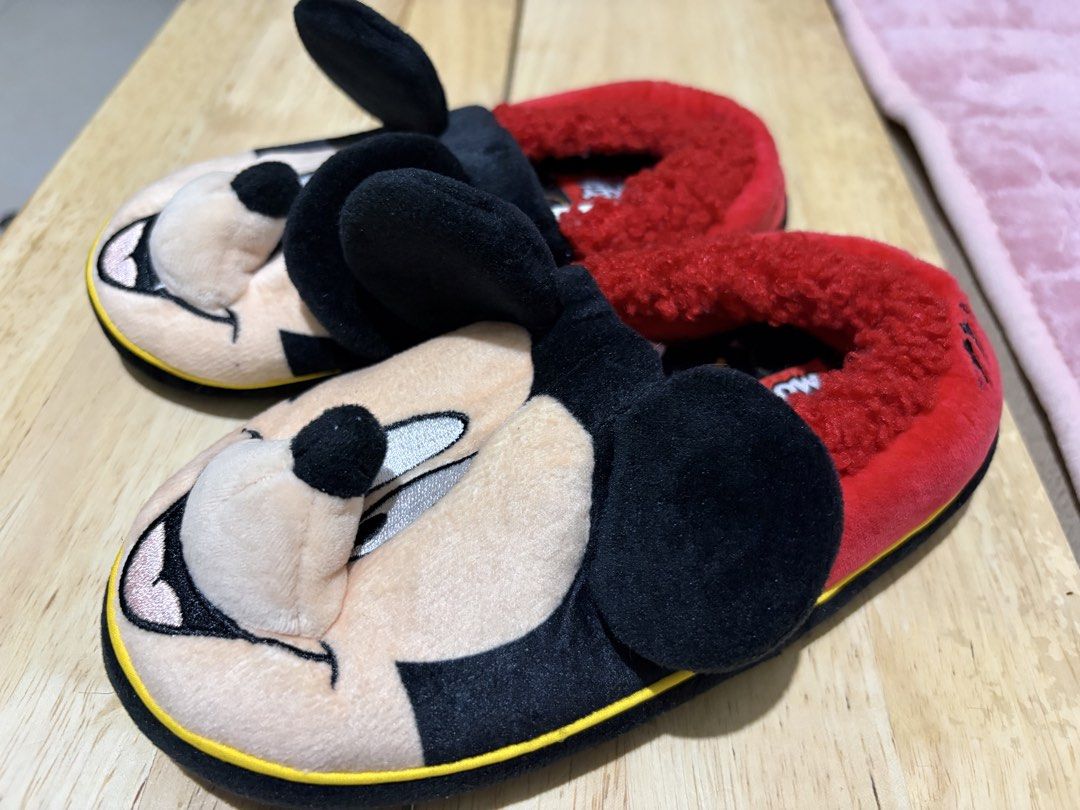 Disney Mickey Mouse Plush Slippers Red Black (Category: Slippers and slides) located in Paranaque City. Submitted by greatfinds108 (Listing ID 1467874635, Image 3). Description: - Adorable 3D Mickey Mouse face and ears on the front - Soft red fuzzy inner lining for ultimate warmth and comfort - Black outer material with stylish yellow piping along the sole - Embroidered Mickey signature detail on each heel back - Cute Disney Mickey pattern print 