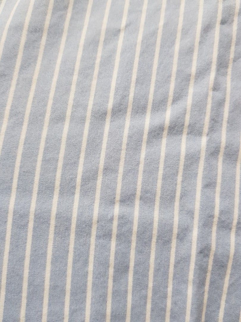Divided by H&M Blue White Striped Button Down Shirt (Category: Shirts) located in Baguio. Submitted by soonshimcart (Listing ID 1467854714, Image 2). Description: - Brand: H&M - Style: Blue and white striped long-sleeve shirt with button-down front and classic collar - Size: Medium - Features: Single chest pocket, lightweight cotton blend - Condition: Excellent, clean with no stains or tears.