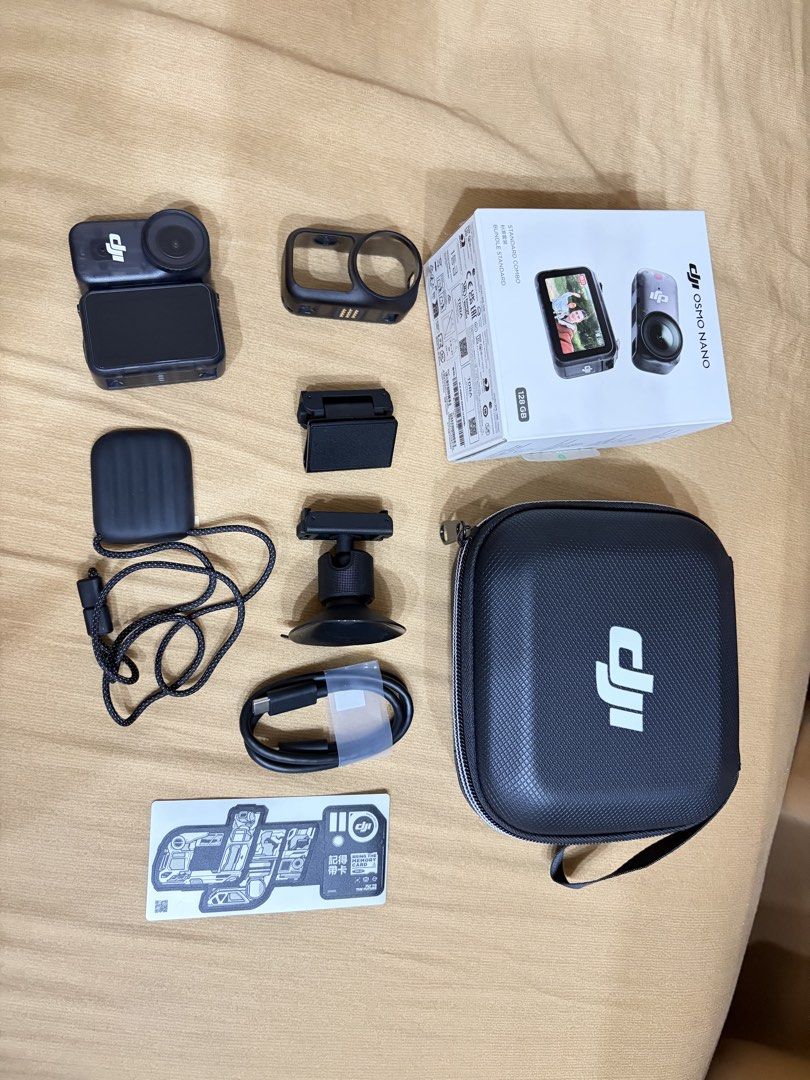 DJI Osmo Nano Standard Combo 128GB Action Camera (Category: Video Cameras) located in Manila. Submitted by camsie09p (Listing ID 1467910652, Image 3). Description: - Product: DJI Osmo Nano Standard Combo - Storage: 128GB - Condition: Complete set in original retail box - Inclusions: Camera unit, protective frame case, magnetic lanyard, mounts, charging cable, sticker sheet, and zippered carrying case - Perfect for: Vlogging and outdoor adventures