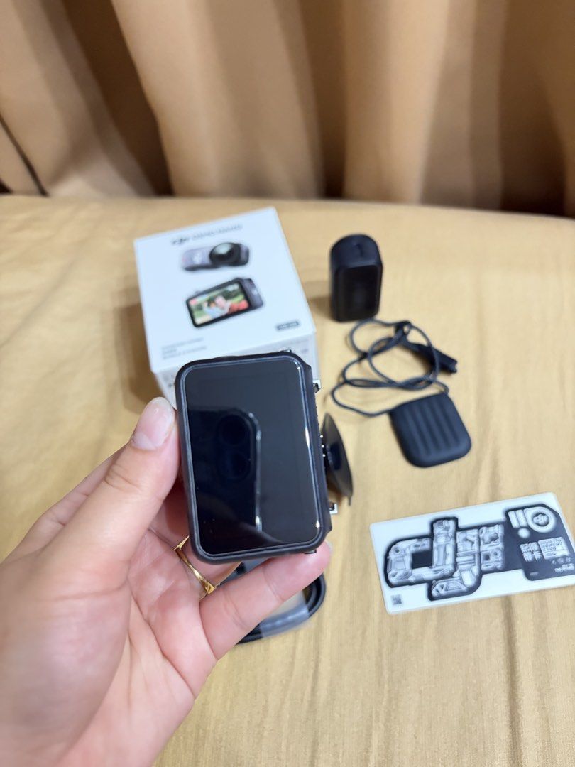DJI Osmo Nano Standard Combo 128GB Action Camera (Category: Video Cameras) located in Manila. Submitted by camsie09p (Listing ID 1467910652, Image 2). Description: - Product: DJI Osmo Nano Standard Combo - Storage: 128GB - Condition: Complete set in original retail box - Inclusions: Camera unit, protective frame case, magnetic lanyard, mounts, charging cable, sticker sheet, and zippered carrying case - Perfect for: Vlogging and outdoor adventures