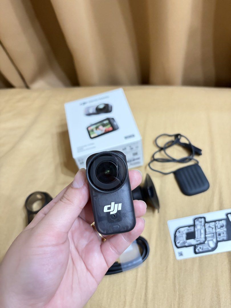 DJI Osmo Nano Standard Combo 128GB Action Camera (Category: Video Cameras) located in Manila. Submitted by camsie09p (Listing ID 1467910652, Image 1). Description: - Product: DJI Osmo Nano Standard Combo - Storage: 128GB - Condition: Complete set in original retail box - Inclusions: Camera unit, protective frame case, magnetic lanyard, mounts, charging cable, sticker sheet, and zippered carrying case - Perfect for: Vlogging and outdoor adventures