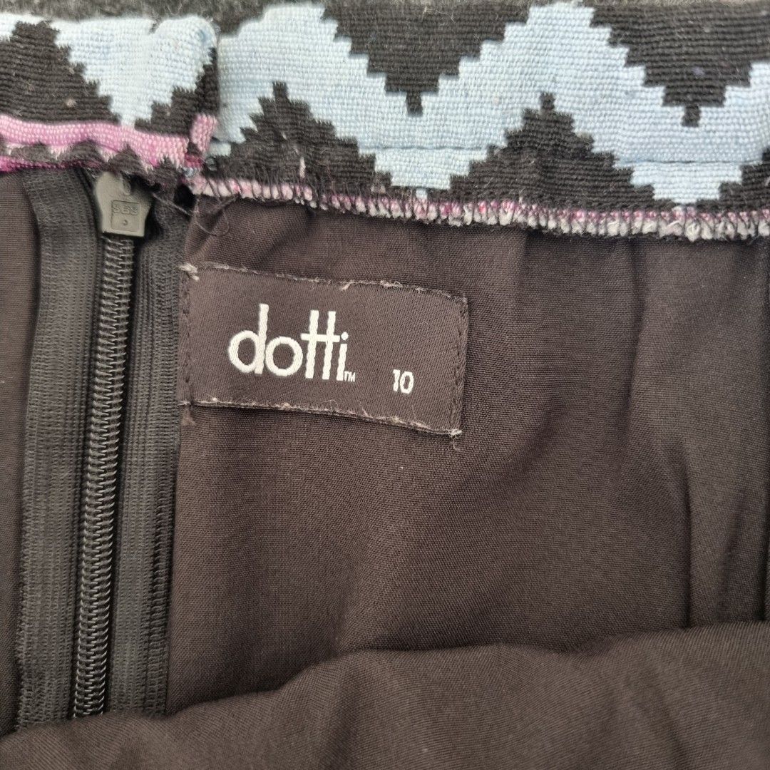 Dotti Aztec Print Woven Skirt Size 10 (Category: Skirts) located in Las Pinas. Submitted by 2nd_soul (Listing ID 1467906673, Image 2). Description: Boho style skirt from Dotti. Size 10 tag inside. Features a colourful Aztec geometric woven pattern with pink, black, grey, and orange tones. Fringe trim along the edge. Zip closure in the back with black lining. Dotti Aztec Jacquard Mini Skirt, featuring a vibrant, multicolored geometric design, a sp